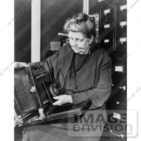 #26768 Stock Photography of Frances Benjamin Johnston Holding and Looking at Her Camera by JVPD