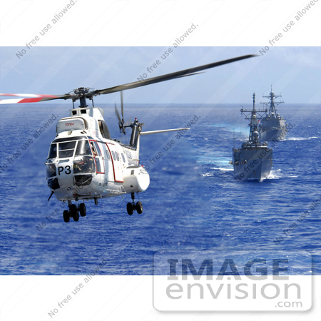 #30642 Stock Photo of an AS-332 Super Puma Helicopter Passing Above a Destroyer and Firgate by JVPD