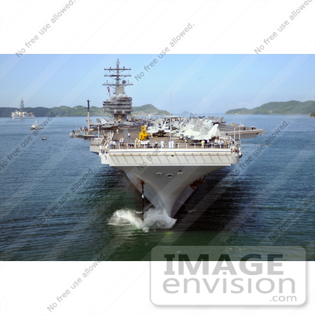 #35244 Stock Photo of The Nimitz-Class Aircraft Carrier USS Ronald Reagan (CVN 76) Dropping Anchor In Sasebo Harbor In Sasebo, Japan For A Port Call by JVPD