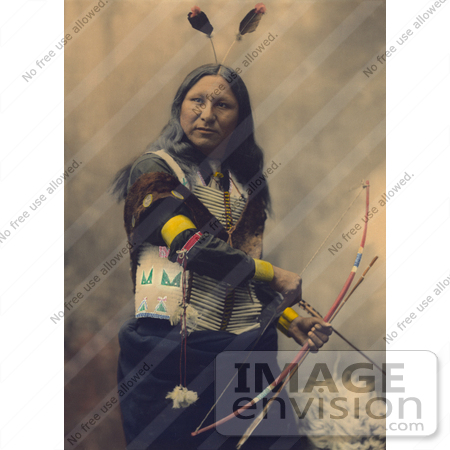 #35635 Stock Photo of a Native American Named Shout At, Oglala Indian, With Two Feathers In His Hair, Looking At The Viewer And Holding A Bow And Arrows by JVPD