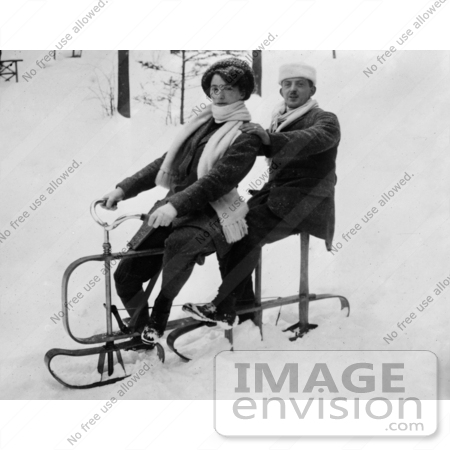 #35669 Stock Photo Of A German Couple Riding A Tandem Sled In The Snow by JVPD
