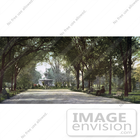 #40886 Stock Photo of People Sitting On Benches Under A Canopy Of Trees Near The Fountain In Forsyth Park, Savannah, Georgia by JVPD