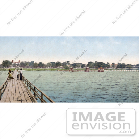 #41055 Stock Photo Of People Taking A Leisurely Stroll On A Bridge At The Mexican Gulf Hotel In Pass Christian, Mississippi by JVPD