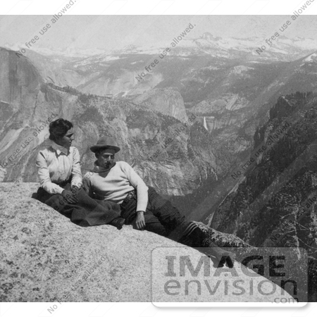 #41172 Stock Photo Of A Couple Relaxing On A Rock Cliff With A View Of The Cap Of Liberty, Nevada Falls And The Sierras From Eagle Peak, Yosemite National Park, California by JVPD