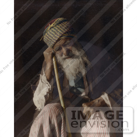 #43477 RF Stock Photo Of A Tired Senior Arab Man Sitting And Leaning Against His Cane, Yemen by JVPD
