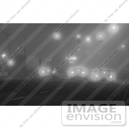 #495 Black and White Picture of a Cars Stopped at a Traffic Light and Foggy Weater by Kenny Adams