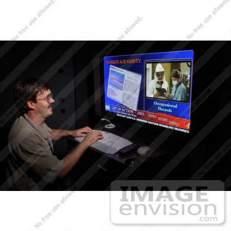 #5135 Picture of CDC Employee, Nick Degner, Creating Graphics for the November, 2003 APHA Conference Exhibit by JVPD