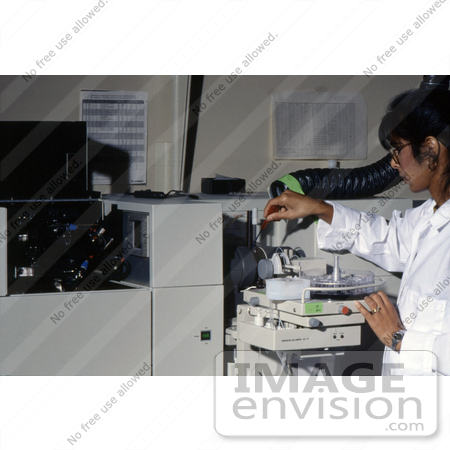 #5318 Picture of a Laboratory Tech Using a Perkinelmer Atomic Absorption Spectroscopy Device by JVPD