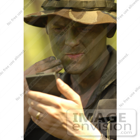 #8868 Picture of a Soldier Applying Camouflage Paint by JVPD