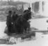 #13740 Picture of Men Pulling Annie E Taylor’s Barrel Out of the Water at Niagara by JVPD