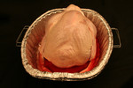 Backside of a Uncooked Thanksgiving Turkey in a Pan