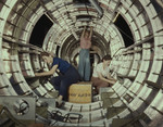 Photo of Three Women Riveters Working Inside a Circular Structure of the Fuselage