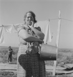 Woman Standing by Laundry Lines