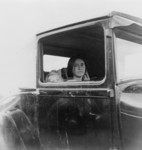 Woman Sitting in a Car