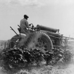 Man Riding a Tractor