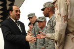 Iraqi Prime Minister Nouri al-Maliki Shaking Hands