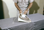 Researcher Preparing a Block of Dry Ice that will be used to Attract Mosquitoes for Arbovirus Studies - 1980