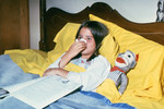 Child Blowing Her Nose and Resting in Bed - 1976