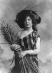 Woman in Serape Holding Wheat