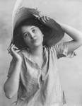 Woman Wearing Battered Straw Hat