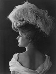 Woman Wearing Feathered Hat
