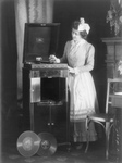 Woman Playing a Record on Phonograph