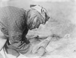 Blackfoot Native Fleshing a Hide