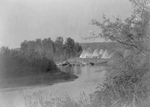 Tipis and Horses Near River