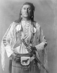 Apsaroke Native Man Holding a Tomahawk