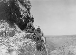 Three Crow Indians on Rock Ledge