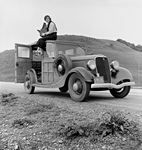 Dorothea Lange on Top of a Car