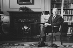 Jimmy Carter Sitting by a Fireplace