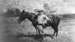 Theodore Roosevelt Beside a Horse