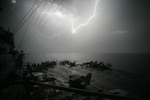 Lightning Near Aircraft Carrier