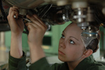 Female Soldier Working on a Jet Engine
