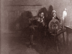 Man and Woman at a Spinning Wheel