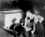 Men Playing Chess on a Train