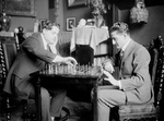 Men Playing a Game of Chess