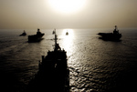Military Ships at Sunset