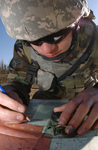 Soldier Using a Map and Compass