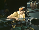 Picture of a Riveter Operating a Riveting Machine