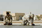 Soldiers Smoothing Cement