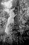 Helen Keller Resting Against a Tree