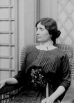 Helen Keller Sitting in a Chair