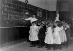 Students and Teacher at a Chalk Board