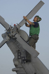 Soldier During Corrosion Maintenance on a Military Helicopter