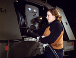 Picture of a Woman Inspecting Gasoline Hoses