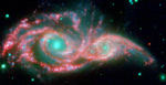 Photo of Galaxies NGC 2207 and IC 2163 Merging as One and Forming a Mask