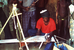 Villagers Watching a Motehun, Sierra Leone Weaver Practicing His Craft