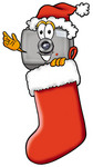Clip Art Graphic of a Flash Camera Cartoon Character Wearing a Santa Hat Inside a Red Christmas Stocking